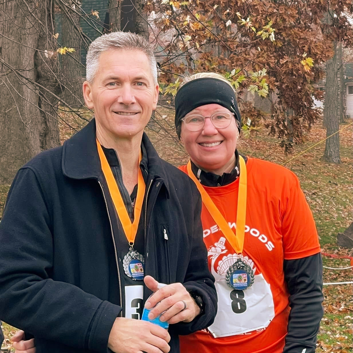 Runners on a scenic autumn trail at Waldenwoods Resort