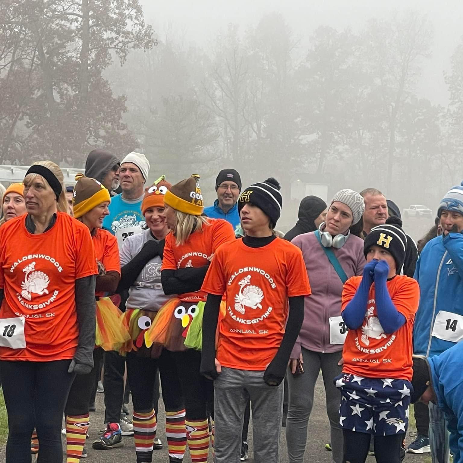 Runners on a scenic autumn trail at Waldenwoods Resort